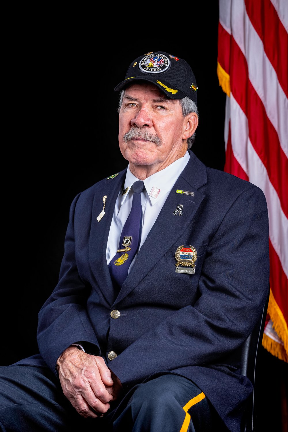 A dignified portrait of a Vietnam War veteran in uniform, honoring their service as part of the Heroes Portrait Project to celebrate and preserve the stories of American heroes.