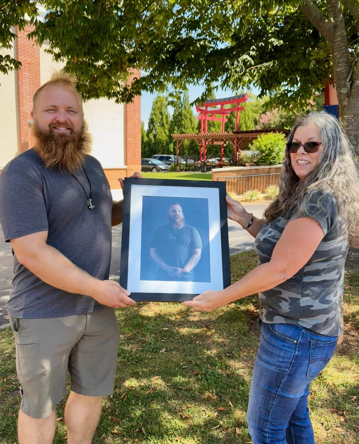 North Carolina Veteran receiving his custom portrait from the Heroes Portrait Project